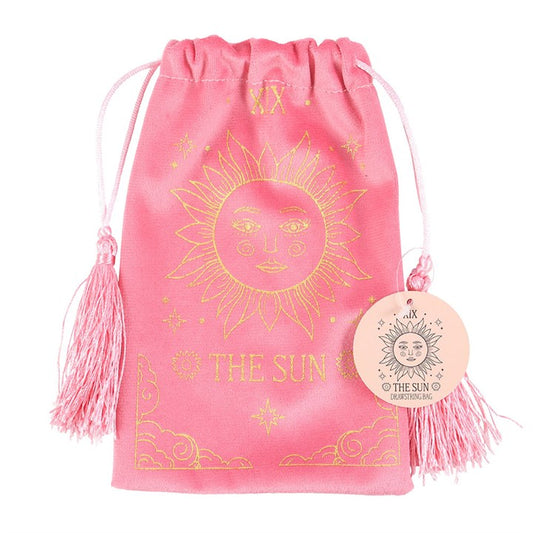 A soft pink velvet drawstring bag featuring a gold printed The Sun tarot card design. Ideal for storing tarot decks, crystals, or small accessories.