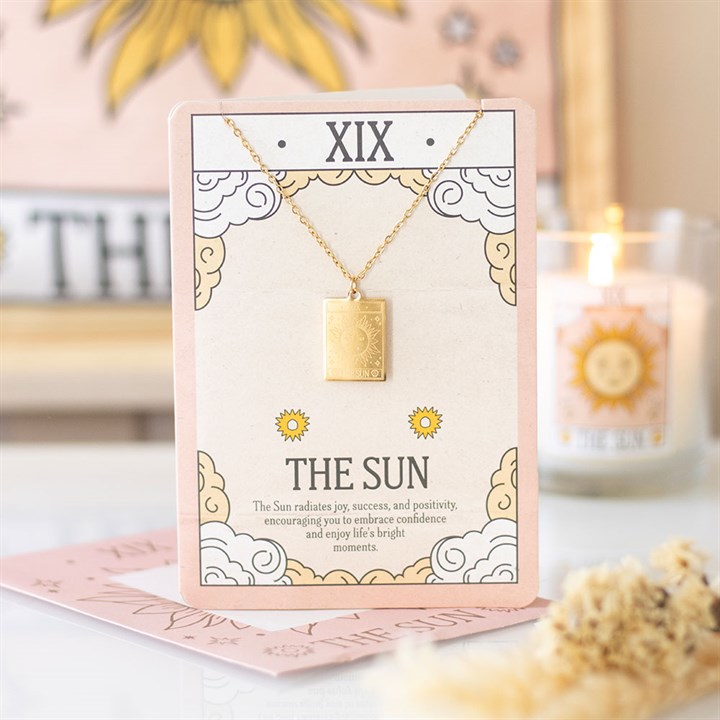 This gold-toned pendant necklace features The Sun tarot card design, symbolising joy, success, and positivity. Presented on a beautifully illustrated greeting card, it makes a thoughtful gift for tarot lovers and celebrating life’s precious moments.