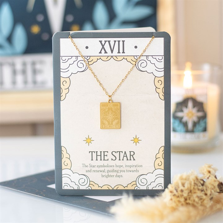 Gold necklace on a card labeled 'The Star' with decorative elements.