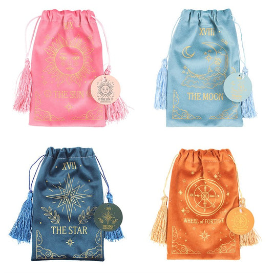 Four drawstring bags with star, moon, sun, and wheel of fortune designs on a white background.
