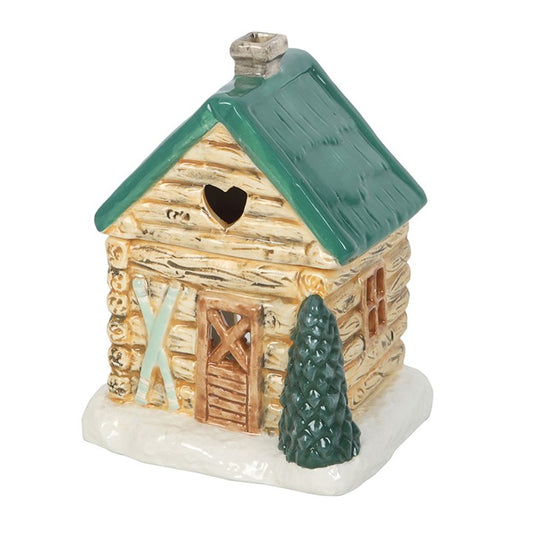 Transport your sacred space to a snow-dusted alpine retreat with this enchanting ceramic oil burner, lovingly shaped like a rustic ski chalet. As the veil of winter wraps around us, invite the comforting aroma of your favourite fragrance oils to dance gently through your home.

Crafted with mindful intention, this oil burner is more than décor—it is a tool for energetic alignment. Add a few drops of cleansing oil blended with water to the bowl, light a tealight within, and allow the flame to awaken the elem
