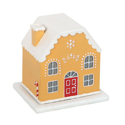 Embrace the enchanting spirit of the season with the Candy Cane Gingerbread House Incense Cone Holder. This mystical piece, shaped like a quaint gingerbread cottage, invites you to create a warm, magical ambiance as fragrant incense smoke curls softly through its chimney, like whispers from a winter fairy tale. Perfect for weaving festive charm and cozy energy into your sacred space, it transforms any room into a haven of seasonal wonder and comforting ritual. Let this delightful holder be your companion in