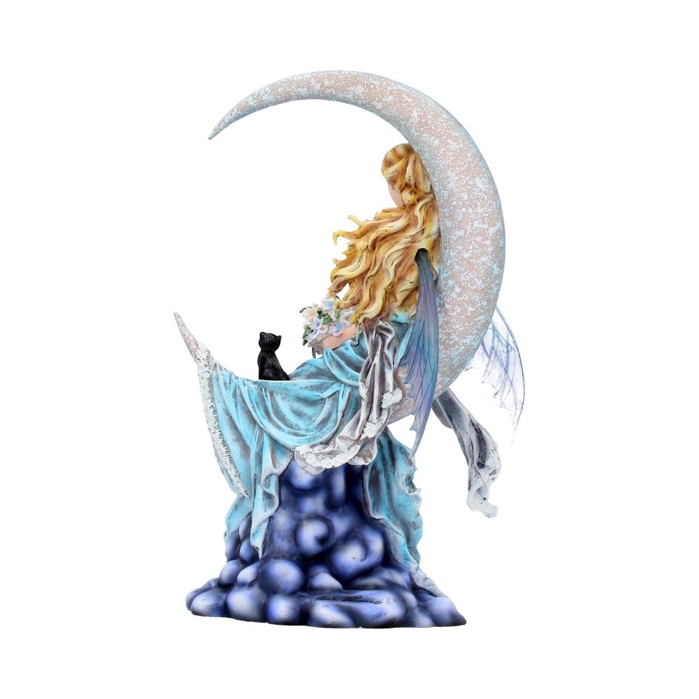 Decorative figurine of a fairy with a crescent moon on a white background
