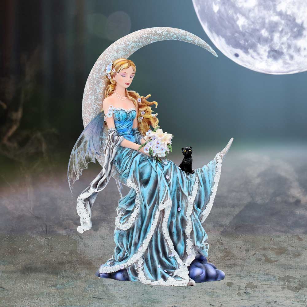 Figurine of a fairy in a blue dress with a cat and dog, set against a moonlit background.