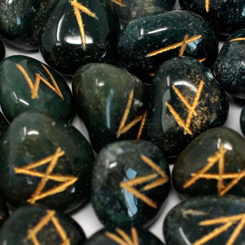 Bloodstone Runes nestled in a pouch, their origins shrouded in mystery. While their true beginnings remain uncertain, many believe these ancient symbols were first wielded between 2000 BC and 100 AD by tribes like the Goths and other Germanic peoples. Each set contains 25 stones: 24 etched with powerful runes and one left blank, ready to reveal your own destiny. Embrace the ancient magic and unlock the secrets of the past with this mystical collection.