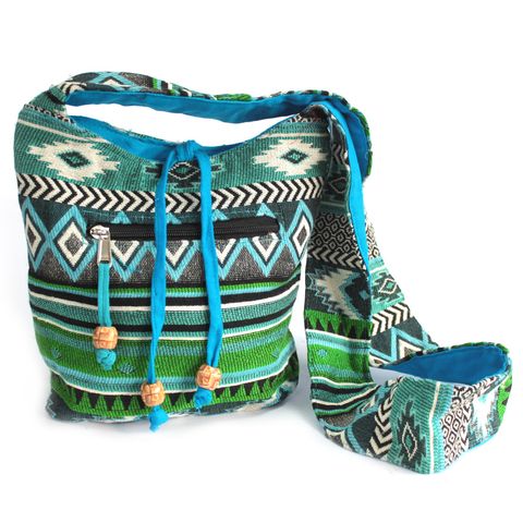 Woven with ancient energy and inspired by the spirit of sacred journeys, this Teal Jacquard Sling Bag is more than an accessory—it is a companion for the awakened soul. Made with rich ethnic jacquard fabric, it carries the vibration of global wanderers, mystics, and seekers of truth.

Whether you're headed to your healing circle, university class, or barefoot walk along the shores of Goa, this bag aligns with your path. Its mystical teal tones resonate with the throat chakra, empowering you to speak your tr