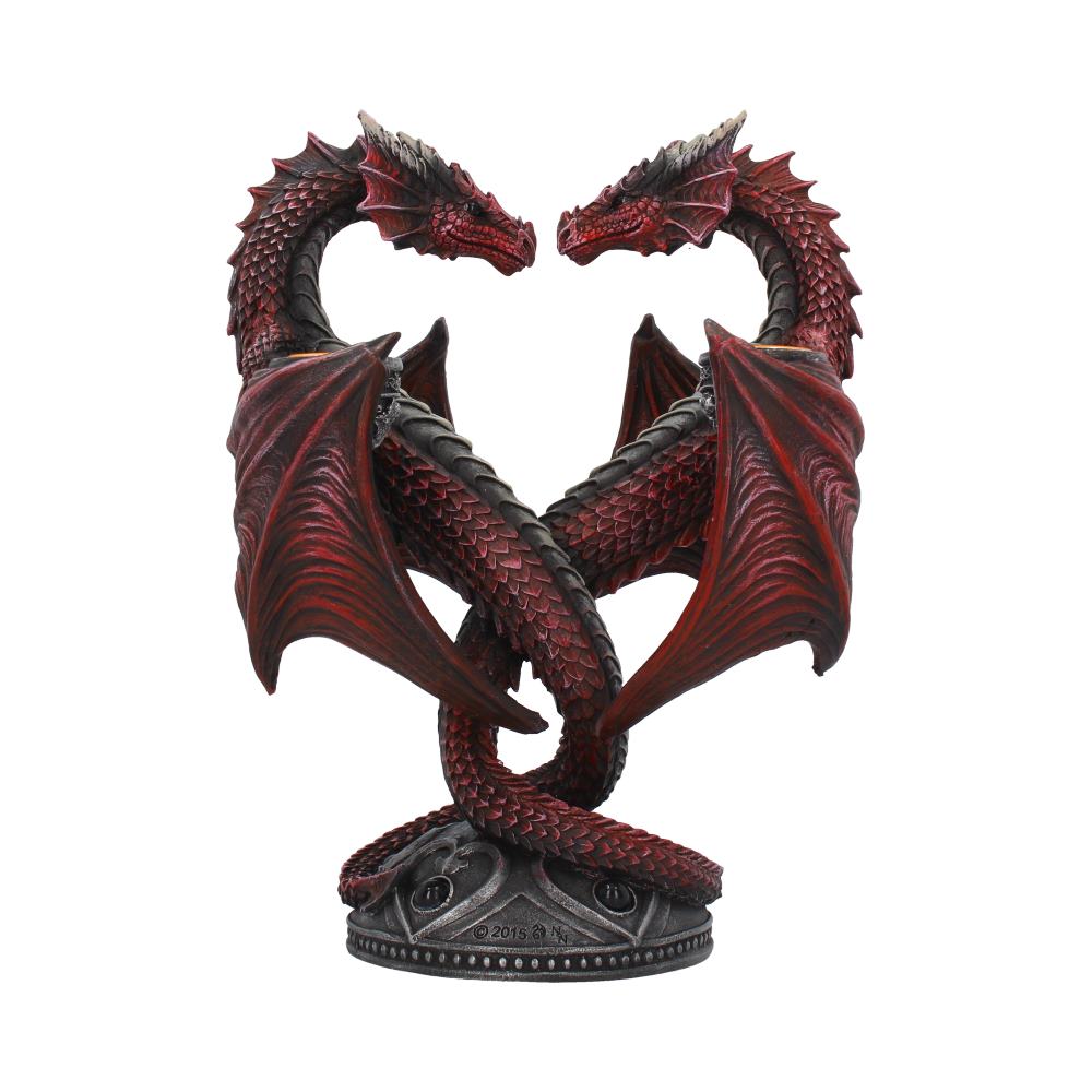 Statue of two red dragons intertwined on a white background