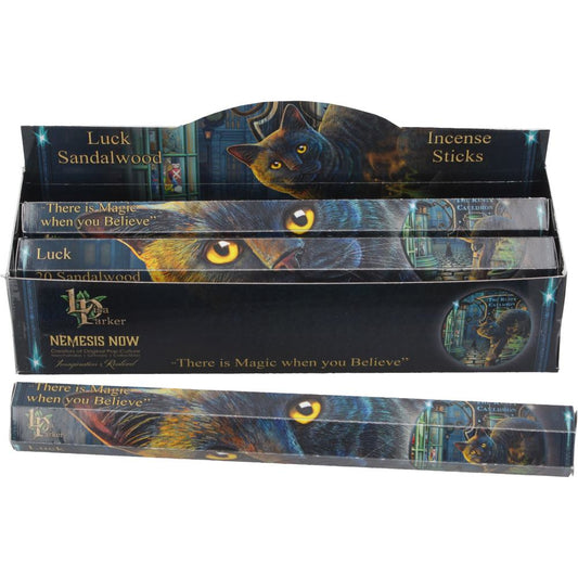 Let luck flow into your sacred space with the soothing scent of Sandalwood and the enchanting artistry of Lisa Parker. This Luck Incense Stick Gift Pack features her iconic Bewitched design — a black cat gazing deeply into candlelight, a familiar spirit of focus, magic, and fate.

Within the pack you’ll&nbsp;20 sandalwood incense sticks, known for their grounding, purifying, and calming qualities. Whether used for spells, rituals, meditation, or simply setting the mood, these sticks are perfect for witches 
