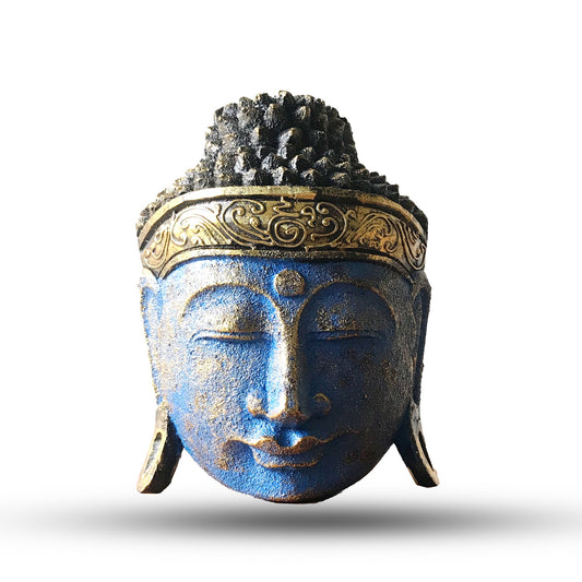 The blue glow of the Buddha is the light of wisdom, a calming presence that brings tranquillity and protection.

This 25cm Buddha Head Statue is hand-carved from eco-friendly albasia wood by skilled artisans in Indonesia and finished with a striking blue shine effect. The luminous tones highlight the Buddha’s serene features, radiating stillness and peace, making this piece both a spiritual symbol and an elegant accent for the home.

The Buddha head, in Buddhist tradition, represents awakened consciousness 