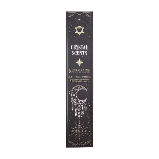 Call in warmth, grounding, and steady earth-magic with this Sandalwood Smudge Incense set, paired with natural tourmaline chipstones for deeper protection and energetic balance. Each stick is handcrafted in India using traditional smudge-style methods, creating a woody, comforting aroma that settles the spirit and softens the edges of your space.

Inside each celestial black sleeve—adorned with moon and dreamcatcher motifs—you’ll find ten smudge sticks (approx. 20 cm), wrapped in printed protective paper, a
