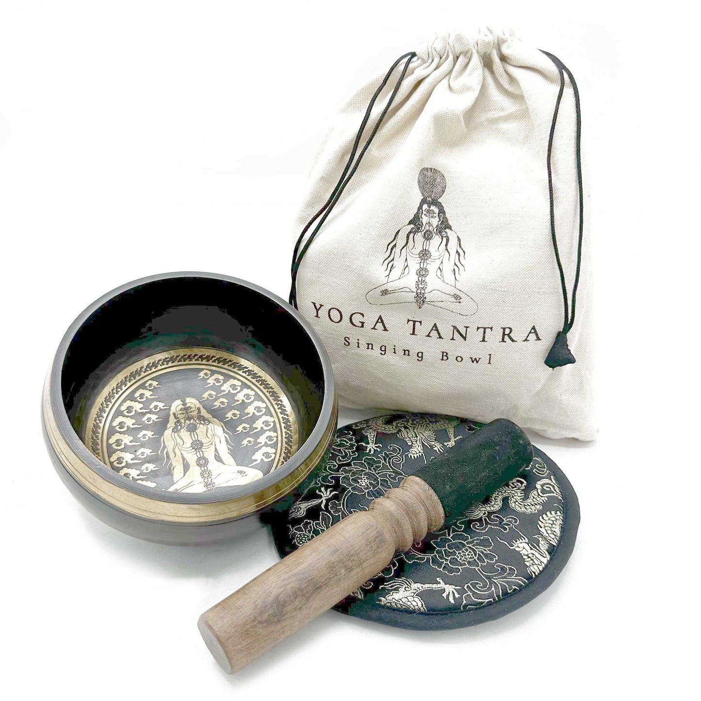 Yoga Tantra singing bowl set with bowl, cover, and mallet on a white background