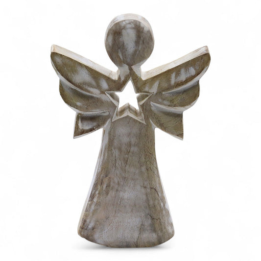 From the celestial artisans of thewitchesgarden, this Mango Wood Angel is a gentle symbol of light, hope, and divine guidance. Hand-carved from sustainable mango wood and finished in a soft whitewash patina, it carries a peaceful, rustic charm that brings warmth and serenity to any space.

At its centre glows a star-shaped cut-out, representing the eternal light that guides and protects. Standing 18cm tall, this angel is perfect as a heartfelt gift, a comforting reminder of faith, or a soothing accent for y