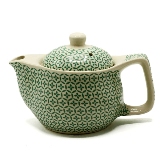 Invite mindfulness and artistry into your tea ritual with this Small Herbal Teapot – Green Mosaic by The Witches Garden. Perfectly sized for individual tea sessions, this beautifully crafted teapot combines functionality with inspired design, encouraging you to savour your herbal infusions in peaceful solitude.

Made from high-quality ceramic, each teapot is both durable and elegant, embodying the essence of mindful craftsmanship. Inside, a fine metal strainer ensures your loose-leaf teas and herbal blends 