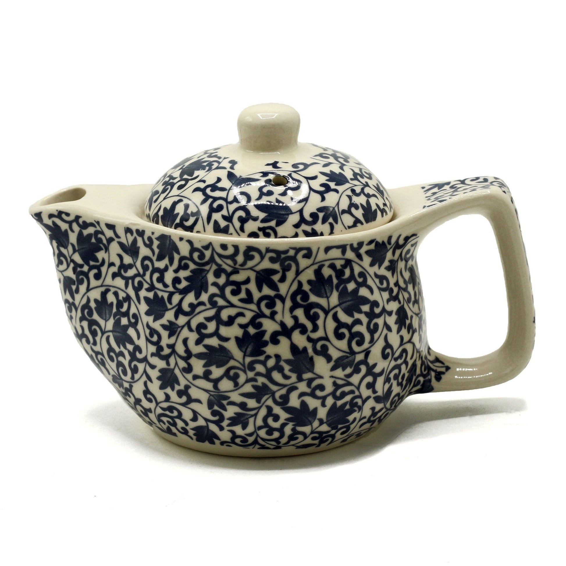 Infuse your tea rituals with calm sophistication through the Small Herbal Teapot – Blue Pattern by The Witches Garden. Designed for those who cherish quiet moments and mindful living, this elegant teapot transforms every pour into an act of peace and contemplation.

Crafted from high-quality ceramic, it promises durability, beauty, and timeless appeal. The blue patterned glaze captures the harmony of flowing water and open sky, bringing balance and serenity to your tea table. Inside, a fine metal strainer e