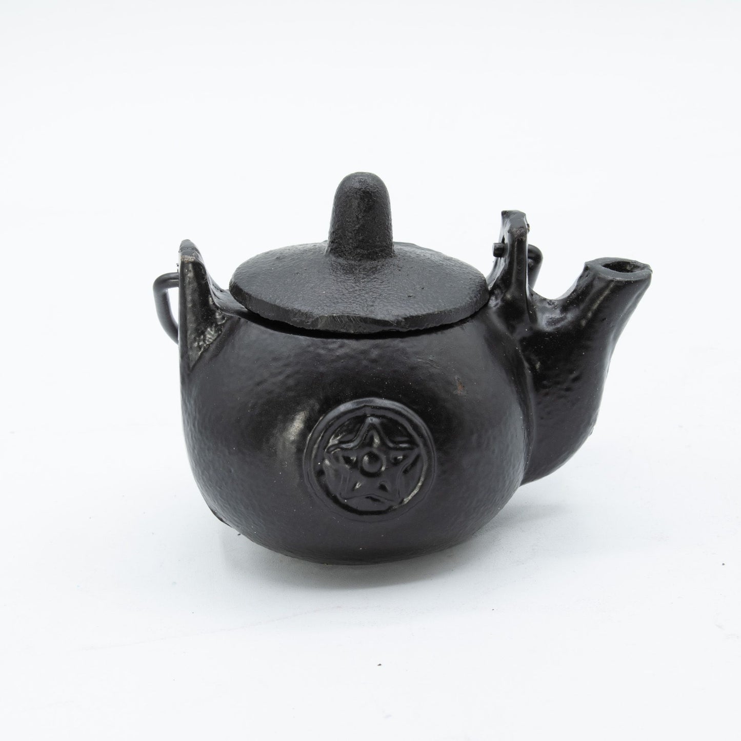 A darkly elegant ritual pot forged from solid cast iron, crowned with a protective lid and commanding side handle. The pentagram embossed upon its surface marks it as a vessel for serious craft—perfect for burning sacred herbs, charcoal, or incense during your most potent workings. Compact yet commanding, this 8x8x10cm cauldron sits perfectly on altar or shelf, radiating gothic presence. The cast iron construction holds heat steadily, containing ash and smoke between rituals while its fitted lid keeps your 