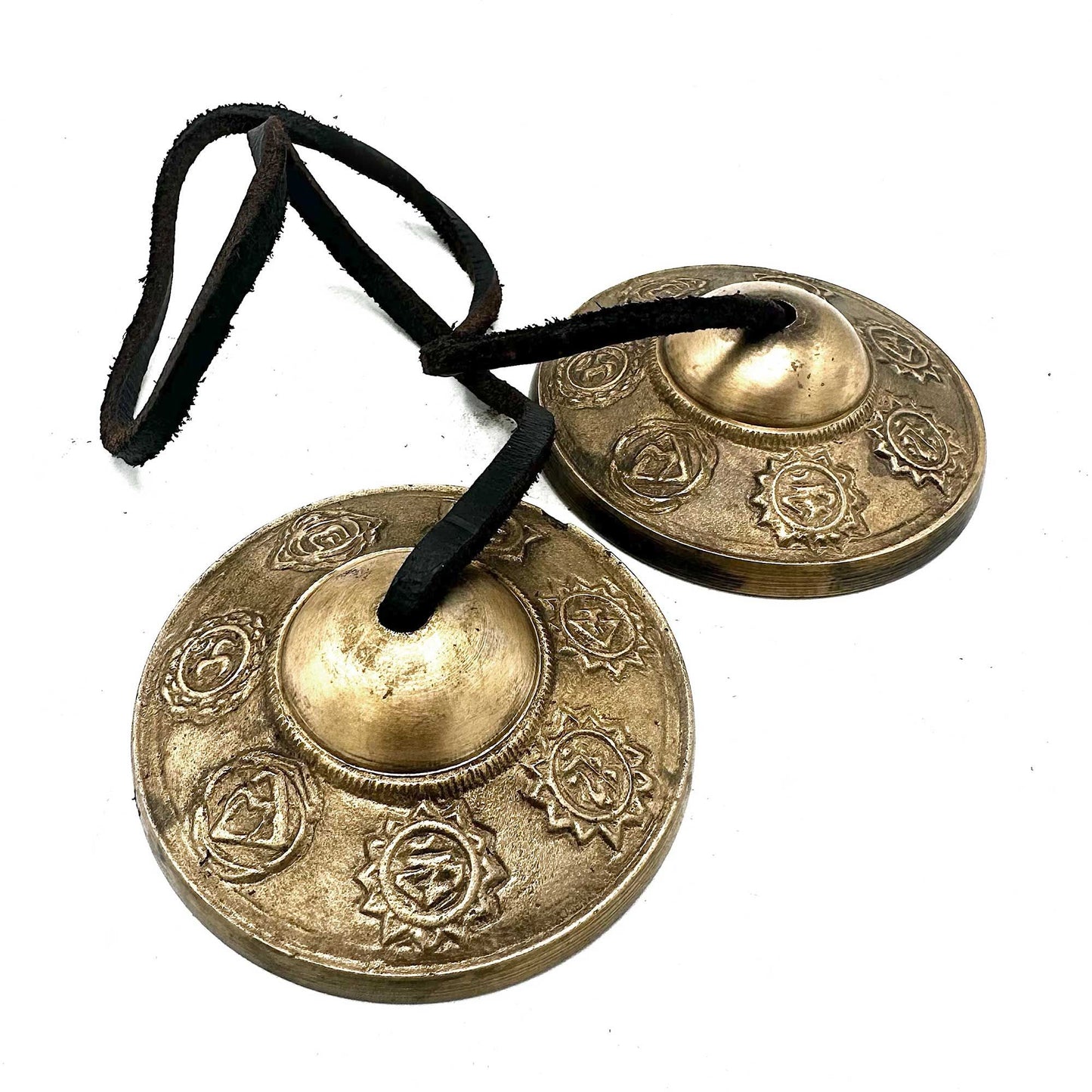 Awaken balance and harmony with the Tibetan Tingsha – Seven Chakra Design, a sacred pair of meditation cymbals crafted with care by skilled Tibetan artisans. Measuring approximately 7cm in diameter, each piece embodies the vibrational essence of the seven chakras, symbols of alignment, spiritual energy, and inner peace.

When gently struck together, the Tingsha produce a pure, melodic resonance that harmonises the body’s energy centres and deepens meditation. Perfect for yoga, mindfulness, sound healing, or