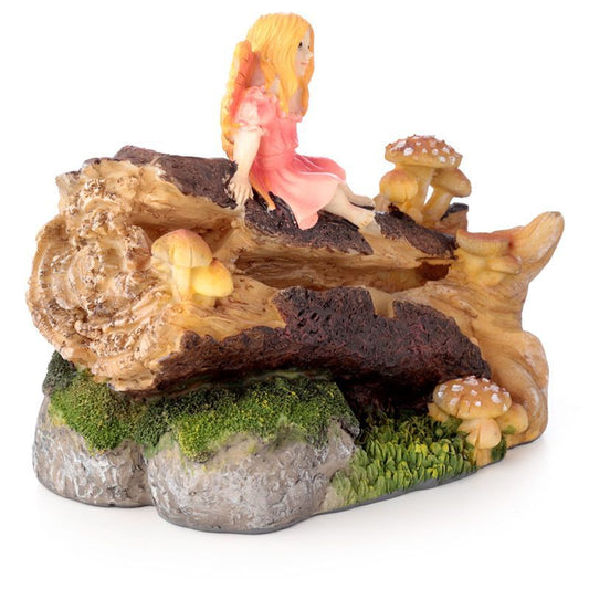 Enter the magic of the forest with the Ancient Woodland Daydream Fairy Backflow Incense Burner. Handcrafted with delicate woodland detail, this piece depicts a serene fairy resting within the trees as cascading smoke flows like mist through the enchanted forest floor.

In folklore, fairies are the guardians of nature, guiding transformation and offering blessings to those who honour the land. The ancient woodland itself is a place of mystery and power, where earth’s energy flows strongest. When paired with 
