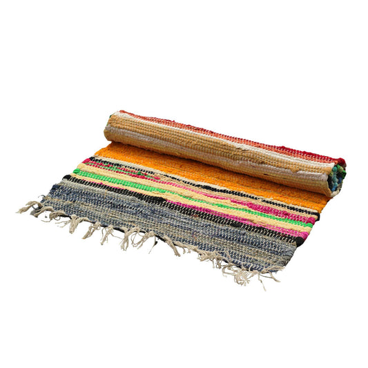 Wanderers of the wild, seekers of soul – welcome to our woven world.
These handmade rag rugs are more than mere floor coverings – they are spellbound story-weavers, conjured from the heart of India. Crafted by skilled hands under fairtrade skies, each rug is a patchwork of purpose, stitched with strands of intention and reclaimed fabric.

No two rugs are the same – and that’s the magic. Woven from recycled cloth, their colours whisper tales of distant lands, caravan journeys, and cottage dreams. Strong enou
