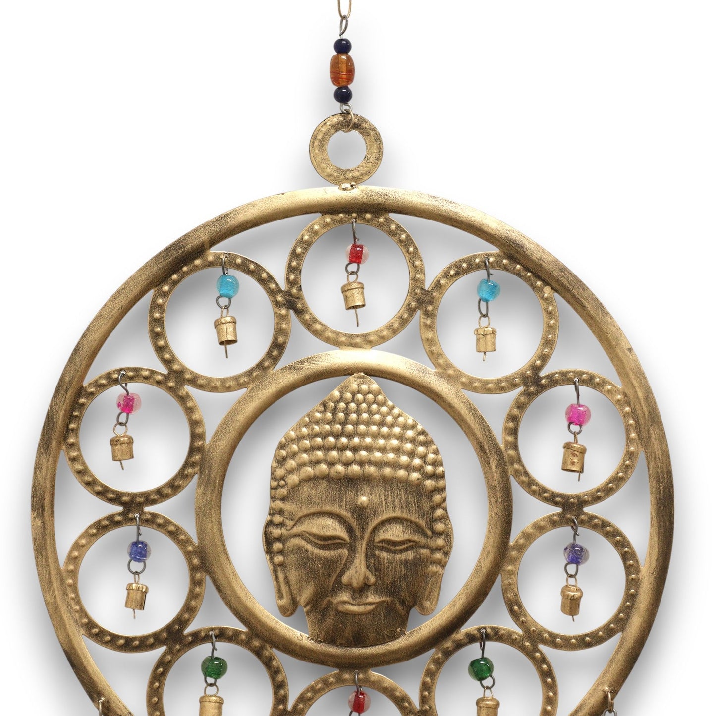 Enrich your space with peace, presence, and sacred resonance through these Indian Chimes featuring a beautifully crafted large Brass Buddha Face. Measuring 36cm, this striking piece radiates calm and spiritual clarity, with the serene Buddha visage framed by delicate circular accents and vibrant, colourful beads that amplify its visual charm.

Fifteen polished brass bells hang gracefully below, each producing a soft, harmonious tone that brings balance and tranquillity to any environment. Ideal for meditati