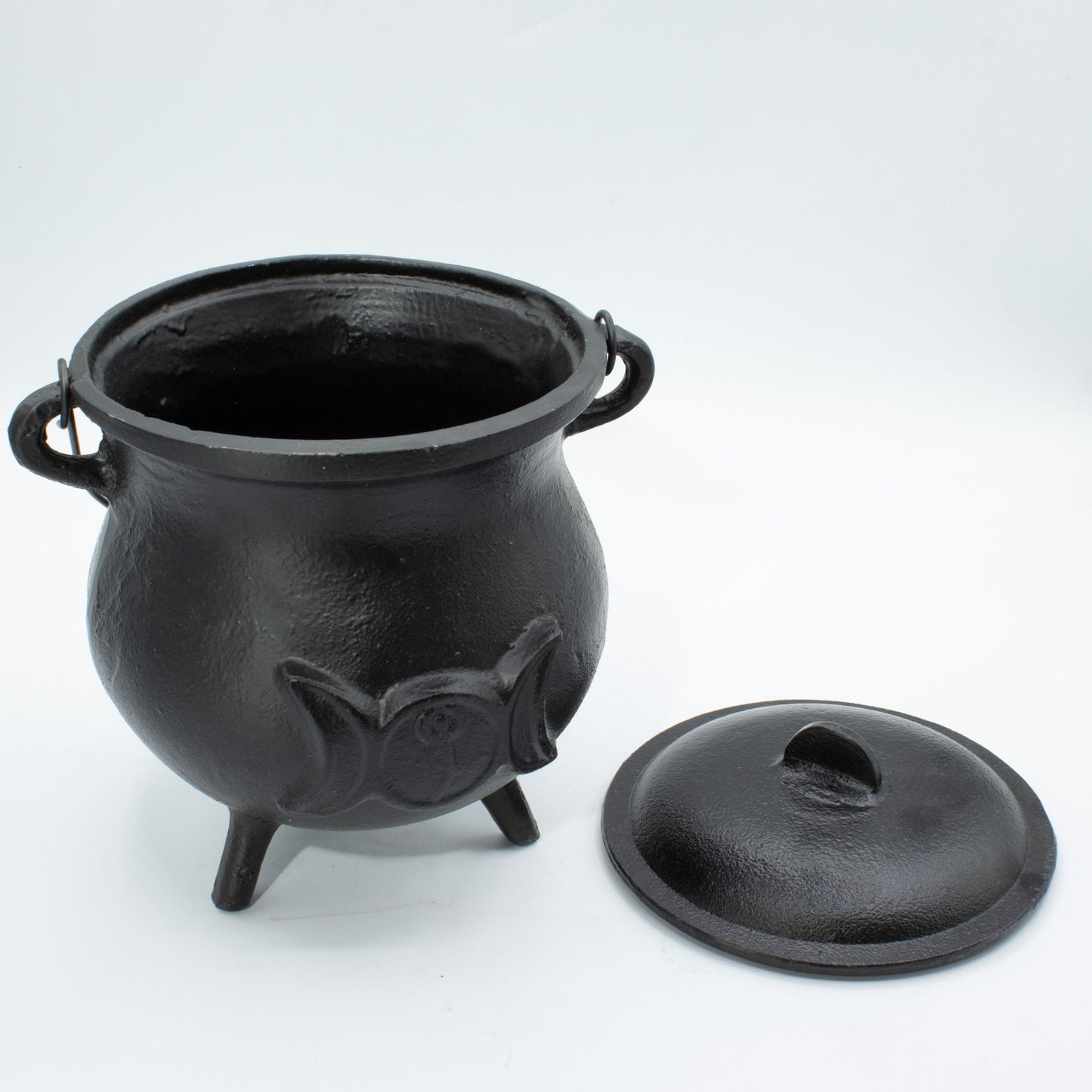 Make a powerful statement on your altar with this Extra Huge Cast Iron Triple Moon Cauldron, a substantial ritual vessel crafted for practitioners who appreciate authenticity, durability, and commanding presence. Embossed with the sacred Triple Moon symbol, this cauldron represents the Maiden, Mother, and Crone, embodying intuition, feminine power, and the cycles of life, death, and rebirth.

Weighing over 4kg, this impressive cast iron cauldron offers exceptional strength and longevity. Its generous capaci