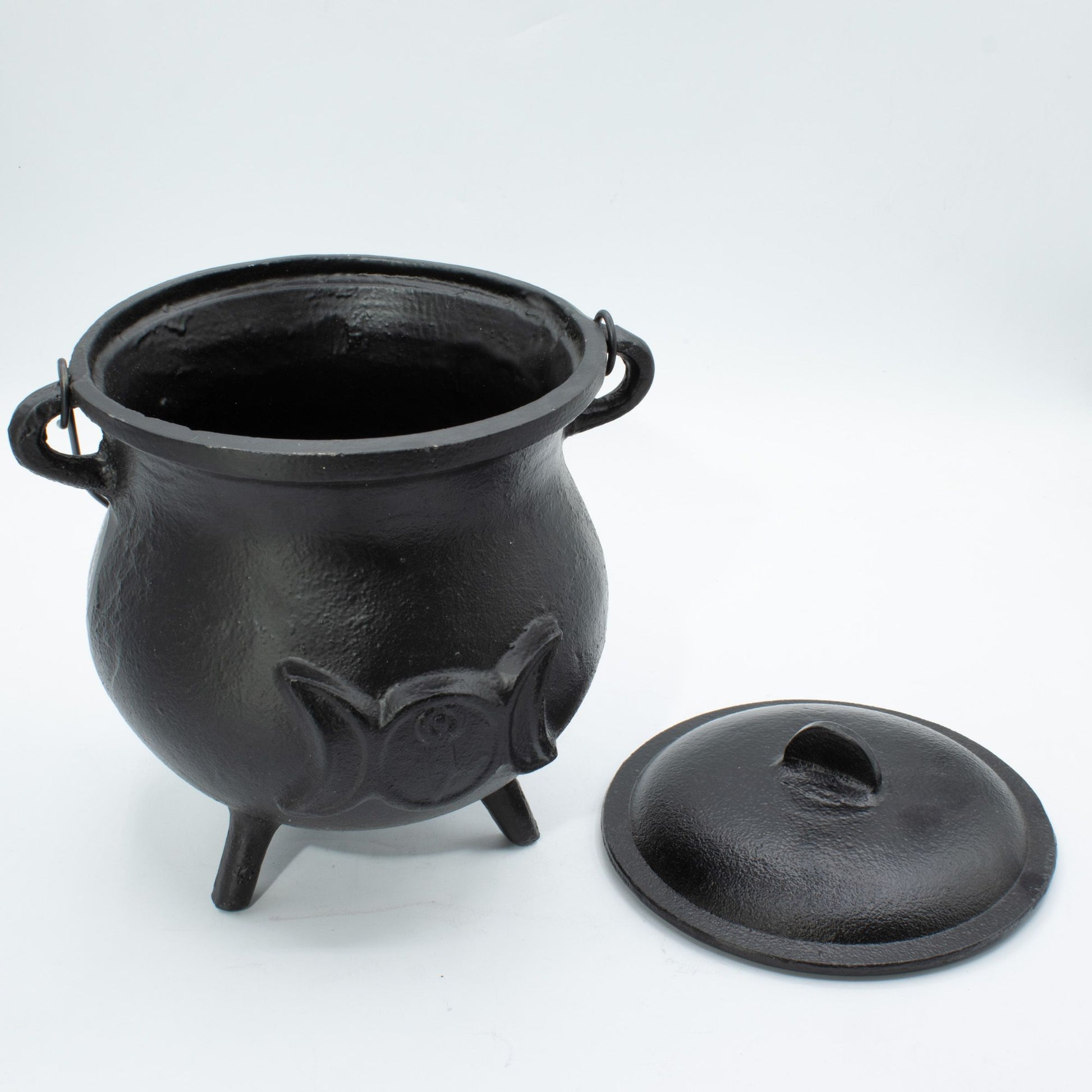 Make a powerful statement on your altar with this Extra Huge Cast Iron Triple Moon Cauldron, a substantial ritual vessel crafted for practitioners who appreciate authenticity, durability, and commanding presence. Embossed with the sacred Triple Moon symbol, this cauldron represents the Maiden, Mother, and Crone, embodying intuition, feminine power, and the cycles of life, death, and rebirth.

Weighing over 4kg, this impressive cast iron cauldron offers exceptional strength and longevity. Its generous capaci