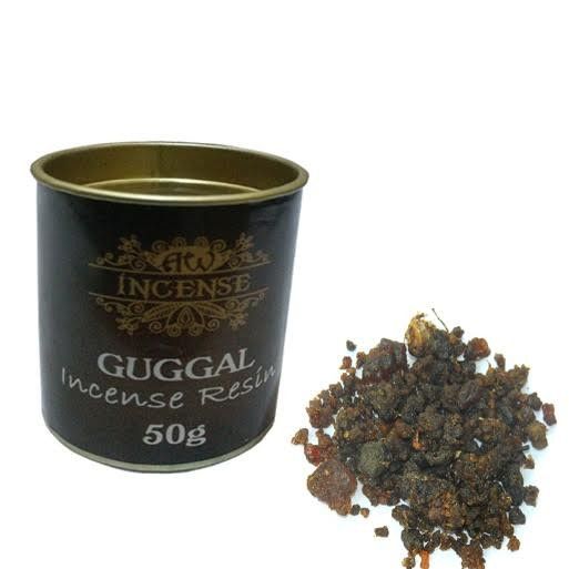 Guggal Incense Resin container with incense resin on a white background