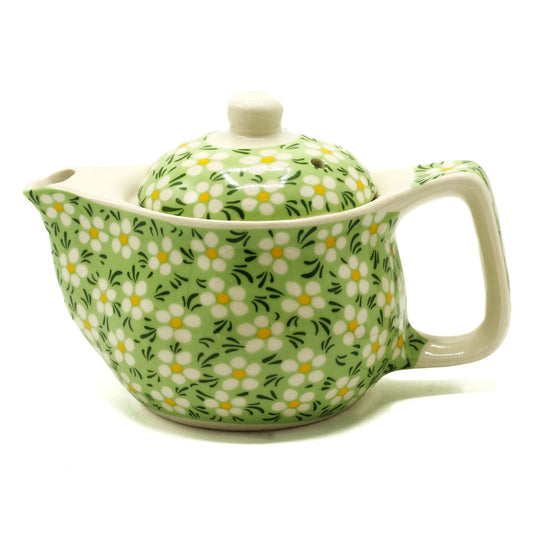 Bring harmony and natural charm to your tea ritual with this Small Herbal Teapot – Green Daisy by The Witches Garden. Designed for quiet reflection and personal enjoyment, this compact teapot transforms each cup into a moment of mindfulness — a time to pause, breathe, and reconnect with nature.

Beautifully crafted from high-quality ceramic, this teapot ensures both durability and a graceful presence on your tea table. Inside, a fine metal strainer allows loose-leaf teas and herbal blends to release their p