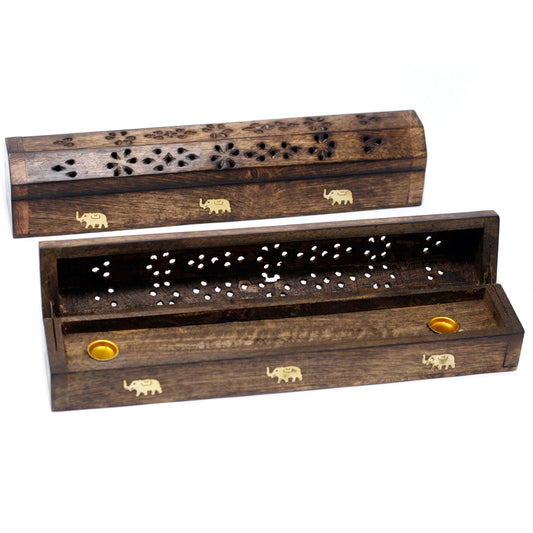 From the sacred collection of thewitchesgarden, these Natural Mango Wood Smoke Boxes are traditional incense burners hand-carved in Saharanpur, Northern India—a region known for its proud artisan heritage. Each box is crafted to hold incense sticks, protecting surfaces while allowing smoke to flow gracefully through intricate carvings. Beyond practicality, the smoke box becomes a vessel of ritual, transforming incense into an offering of spirit and intention. By choosing these incense burners, you not only 