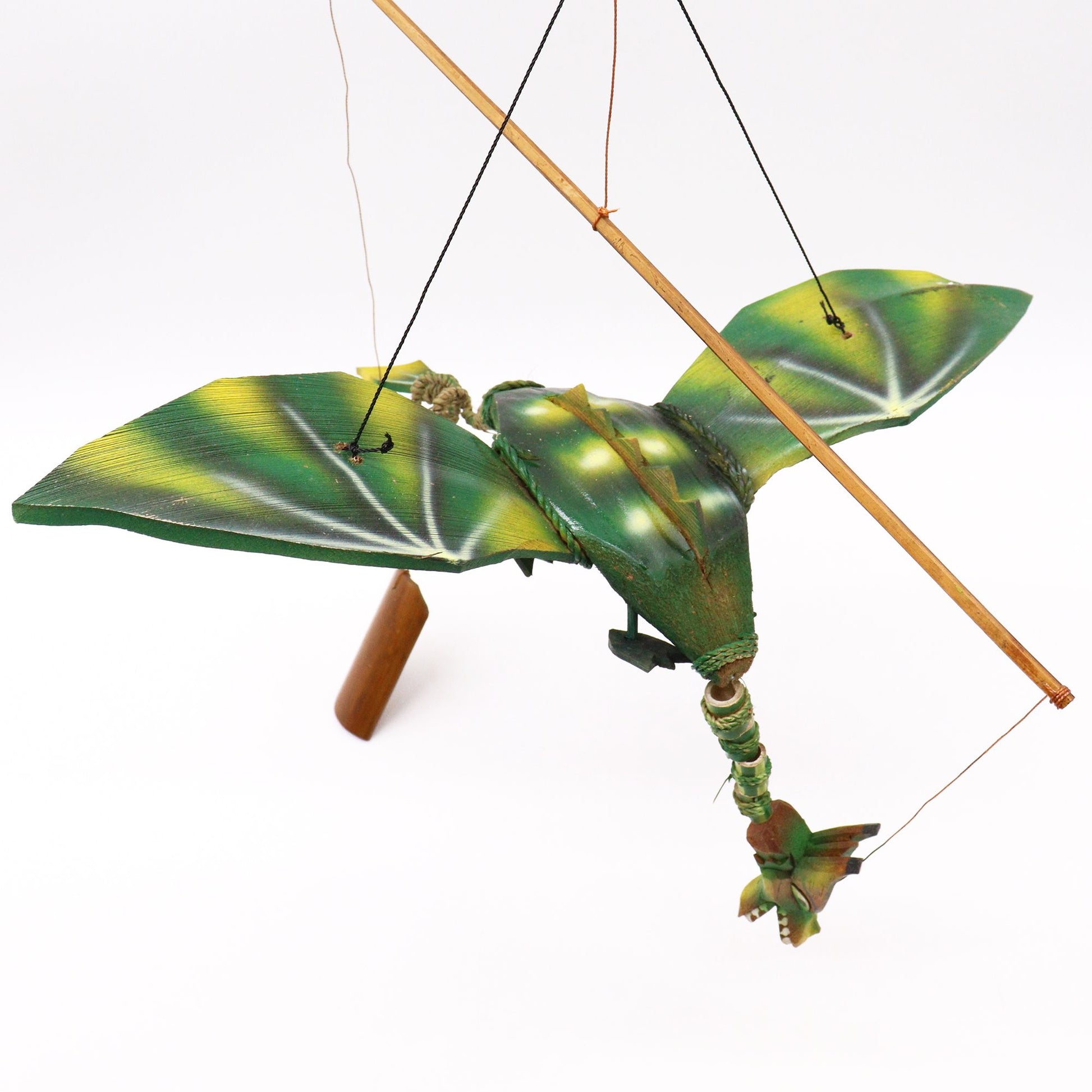 Green coconut dragon hanging mobile with 37cm wingspan. Unique garden or home dragon decor that moves gently in the breeze.