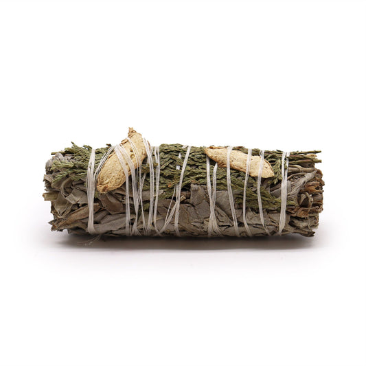 This sacred triad of White Sage, Ginger, and Cedar weaves together cleansing, strength, and deep-rooted healing. Bound in harmony, this smudge stick carries the ancient medicine of Earth, Fire, and Forest—crafted for spiritual warriors and energy alchemists.

White Sage clears away stagnant energy and unwelcome spirits. Ginger calls in courage, vitality, and solar power. Cedar roots your energy to the Earth while offering protection and ancestral connection. Together, they create a ceremonial blend that awa