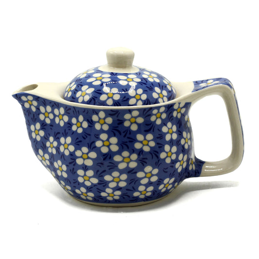 Awaken your senses and embrace mindful tea moments with this Small Herbal Teapot – Blue Daisey by The Witches Garden. Crafted from durable ceramic and designed for personal tea rituals, this petite teapot offers an intimate, soul-soothing experience — perfect for sipping calming herbal infusions in quiet reflection.

The Blue Daisey design evokes natural serenity, symbolising peace, clarity, and renewal. Inside, a fine metal strainer ensures your loose-leaf teas steep to perfection, releasing their full aro
