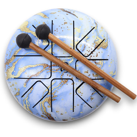 Breathe in stillness and play into peace with the Med Hapi Drum Blue Sky – 17x13cm. With its uplifting sky-blue finish and resonant 8-tone scale, this steel tongue drum invites clarity, calm, and creative flow. Its gentle tones are perfect for meditation, breathwork, sound healing, and emotional release.

The size is ideal for personal practice or travel, offering a soothing sonic experience without overwhelming the senses. The colour blue connects with the throat chakra (Vishuddha), encouraging clear expre