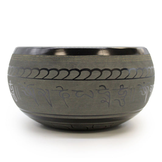 Decorative bowl with engraved patterns on a white background