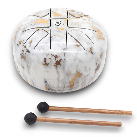 Enter a state of grounded harmony with the Med Hapi Drum Marble – 17x13cm, a beautifully balanced instrument that merges earth and sky through tone and texture. The elegant marble-like finish invokes the energy of stone—solid, ancient, and wise—while the 8-tone scale offers a smooth and stabilising sound ideal for chakra work, meditation, and energy healing.

This drum becomes a bridge between the physical and the subtle, helping you realign body, mind, and spirit. Its size makes it portable without sacrifi