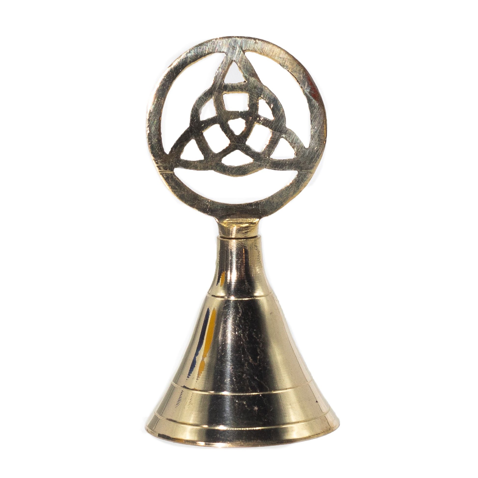 Channel the power of sacred geometry with this Altar Brass Bell – Triquetra, a symbol of eternity, protection, and spiritual unity. Handcrafted from solid brass and crowned with the ancient threefold knot, this bell resonates with timeless Celtic tradition and mystical energy.

Standing 10.5cm tall, it carries a balanced weight and produces a clear, resonant tone, making it an essential tool for rituals, meditation, and energy work. Crafted in India by skilled artisans, the polished brass finish adds elegan