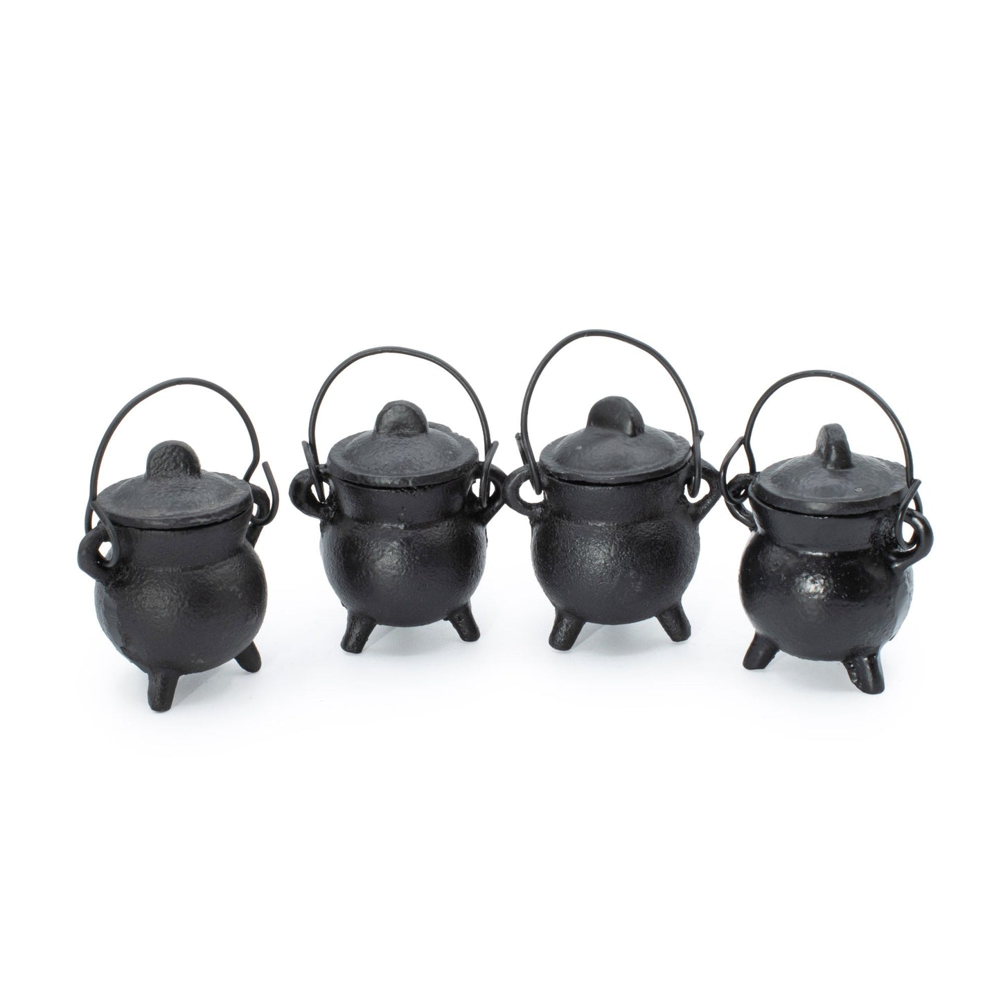 Small, simple, and brimming with gothic charm. This set of four extra small cast iron cauldrons captures the essence of witchy tradition in a perfectly petite size. Perfect for burning incense, herbs, or cones, they nestle beautifully on shelves, altars, or desks without demanding space. The sturdy three-leg base keeps them grounded and stable, while the fitted lid traps ash and contains the mystique. Each cauldron features a small handle for effortless repositioning between your sacred spaces. A versatile,