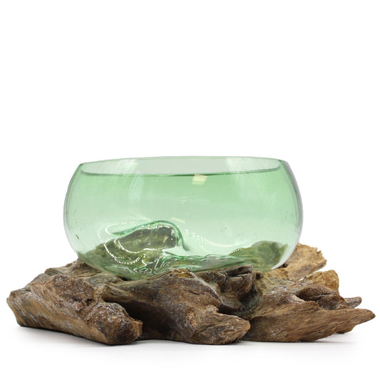 Make a bold eco-boho statement with our Large Wide Bowl on Wood, handcrafted from molten recycled beer bottles and a warm wooden base. Each piece is handmade in Indonesia, ensuring a unique, one-of-a-kind creation. The flowing green glass atop rustic wood creates a striking organic design, perfect for serving, displaying, or simply adding earthy elegance to your home décor.

In bohemian folklore, recycled glass symbolizes transformation and renewal, turning what was once discarded into something beautiful a