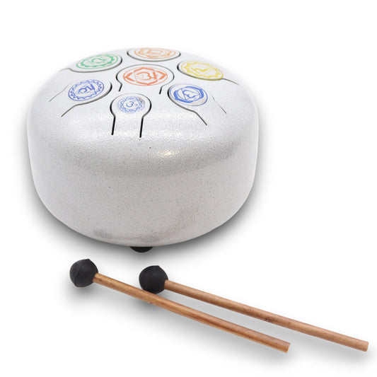 Tune into the healing rhythm of your soul with the Med Hapi Drum 7 Chakra. Crafted with intention and tuned to resonate across eight harmonious tones, this 17x13cm drum becomes a powerful tool for sound healers, energy workers, and spiritual seekers alike. Whether you're clearing energy, meditating, or guiding a healing session, this versatile drum activates the full spectrum of the chakra system through vibration and frequency