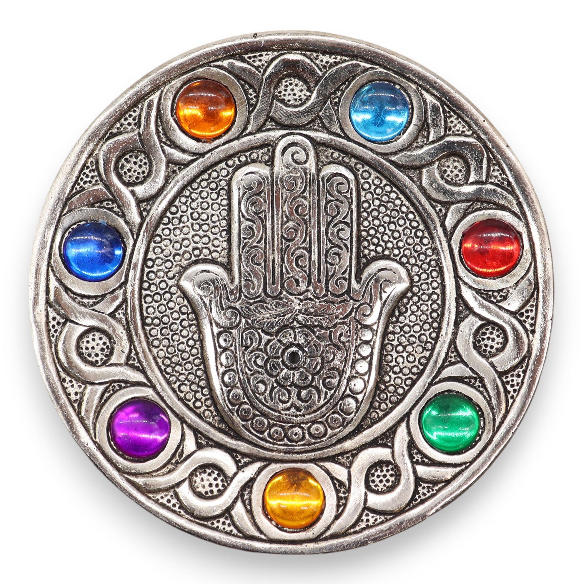 &nbsp;Measuring 11.5 cm, this piece is designed to accommodate standard incense sticks while adding a touch of elegance and meaning to any space.

Featuring the iconic Hamsa symbol, renowned for its protective qualities, this holder is beautifully adorned with the vibrant colours of the seven chakras. Each chakra represents a different energy centre, promoting balance and well-being, making it an ideal addition for those focused on mindfulness and spiritual practices.