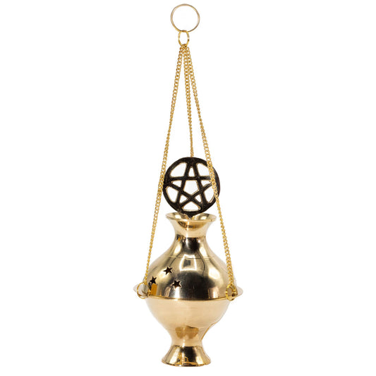 Honour the sacred with this handcrafted Hanging Brass Incense Burner, adorned with the protective Pentagram symbol. Made in India from polished brass, it combines timeless craftsmanship with deep spiritual meaning.

The burner hangs gracefully from three golden chains with a central loop, allowing you to suspend it over an altar, in a ritual space, or within your home. Star-cut vents release fragrant smoke beautifully, creating a mystical atmosphere for meditation, offerings, or spellwork.

Designed for use