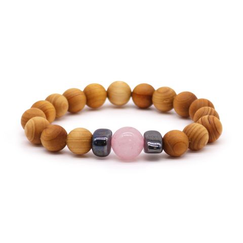 Embrace love and healing with the Cedarwood Heart Chakra Bangle, featuring Rose Quartz to open the heart and inspire compassion. The soothing scent of cedarwood brings calm and spiritual balance, making this bracelet a mystical talisman for self-love and harmony. Perfect as a thoughtful gift or a personal charm to nurture emotional well-being. Bracelet diameter: 7cm; bead diameter: 1cm.