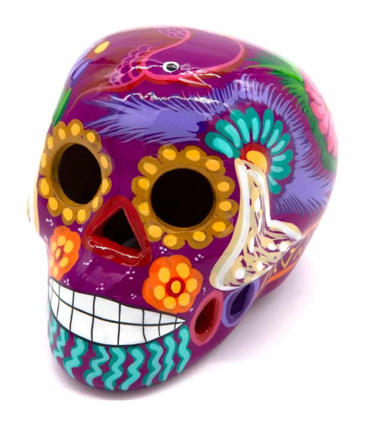 These fun ceramic sugar skull ornaments have been beautifully painted in bright colours and finished with a high shine glaze.  They are a popular item during Día de Los Muertos or Day of the Dead festivities, held in Mexico every November to celebrate welcoming the souls of their deceased relatives back for a time of food, drink and celebration.