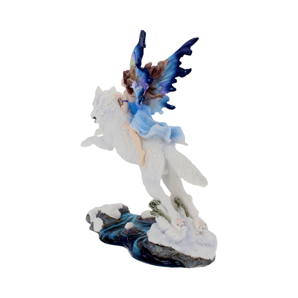 Fairy figurine with blue wings and white dress standing on a rock with a white background