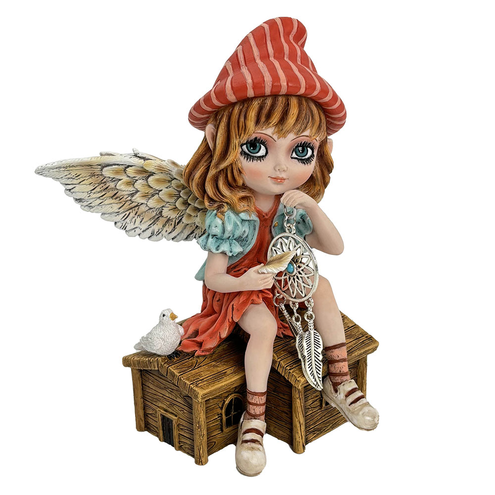 Fairy figurine with wings and a red striped hat holding a dreamcatcher on a white background