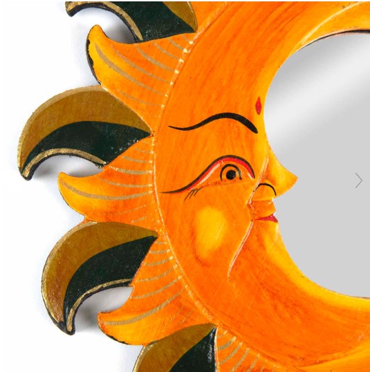 This exquisitely hand-carved mirror displays two moons within sunrays and is finished with sumptuous gold embellishments. A hoop on the reverse side promotes easy wall-hanging and the piece is certified Fairtrade, expertly handcrafted in Indonesia.