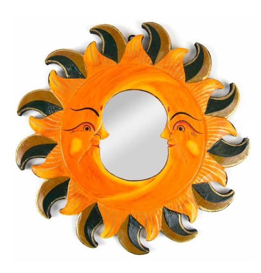 This exquisitely hand-carved mirror displays two moons within sunrays and is finished with sumptuous gold embellishments. A hoop on the reverse side promotes easy wall-hanging and the piece is certified Fairtrade, expertly handcrafted in Indonesia.