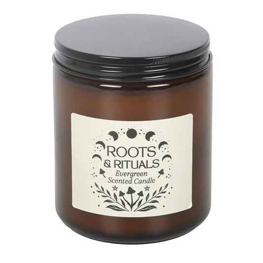 Bring the forest indoors with this evergreen scented candle, presented in an amber glass jar with a mystical Roots &amp; Rituals label. Perfect for grounding rituals or creating a fresh, nature-filled atmosphere. Approximately 22-hour burn time. Made from paraffin wax. Never leave a lit candle unattended.