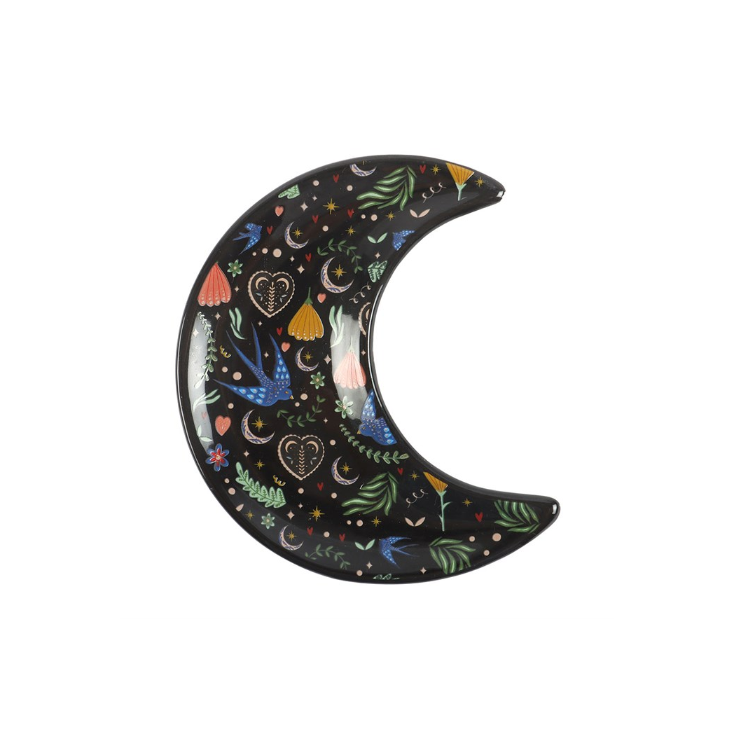 Decorative plate shaped like a crescent moon with colorful designs on a white background