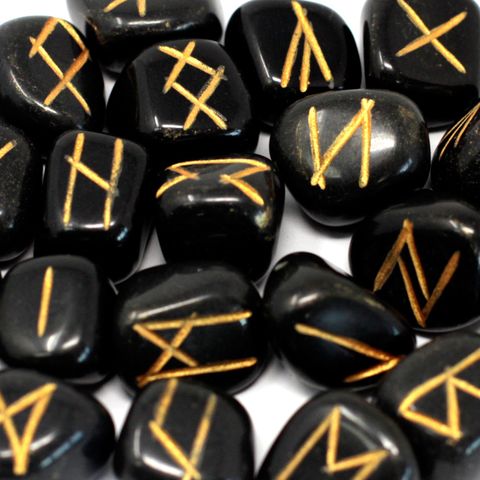 Tap into ancient wisdom with this Black Agate Rune Stone Set, beautifully hand-carved and polished in India. Each set includes 25 stones—24 engraved with traditional Elder Futhark runes and 1 blank stone, used for fate or the unknown. These runes are housed in a soft drawstring pouch for safekeeping.

Black Agate is a powerful grounding stone, known for offering protection, emotional balance, and inner strength. It helps ward off negative energies and encourages clarity during readings and spiritual work. W