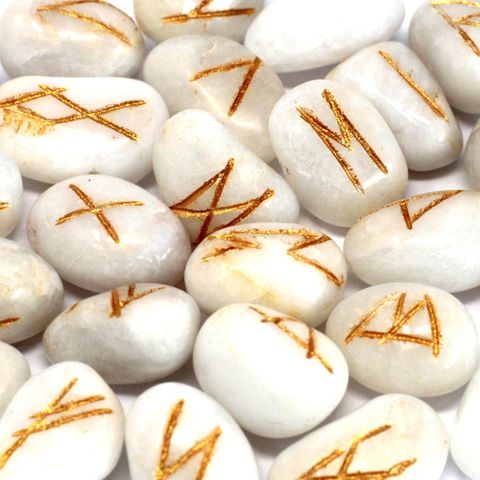 Discover the powerful energy of our White Agate Rune Set, featuring 25 beautifully crafted semi-precious stones, including 24 engraved with ancient runic symbols and one blank stone for personal intentions. White Agate is known for its calming and grounding properties, helping to balance emotions, enhance clarity, and promote inner peace. Ideal for divination, meditation, or ritual work, these runes come in a convenient pouch, perfect for carrying or gifting. Harness the healing vibrations of white agate to